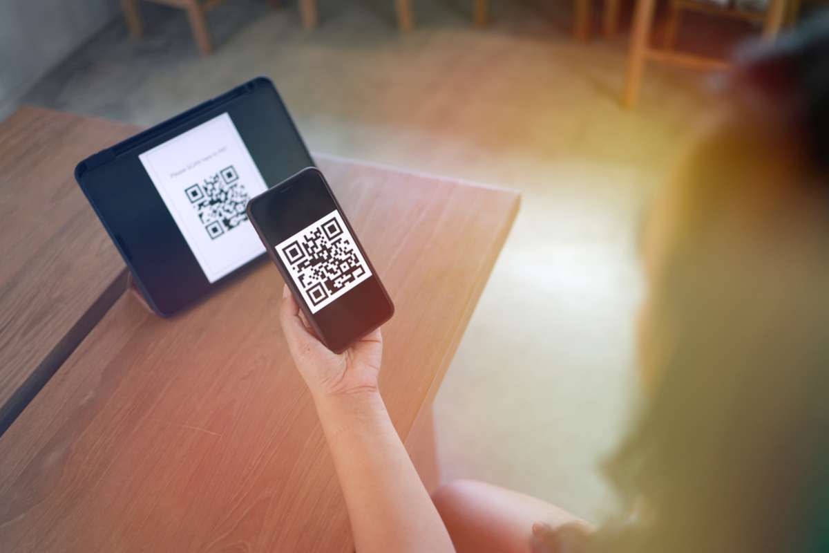 A QR code on a brochure helps connect offline and online roofing contractor marketing efforts