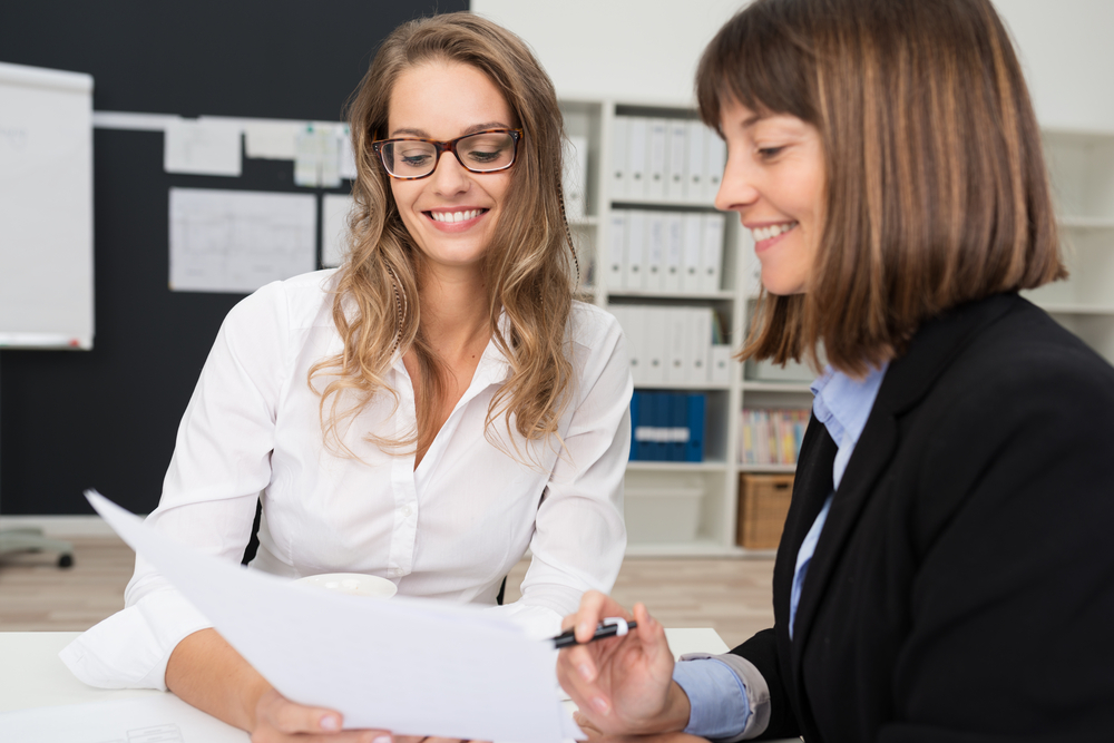 Two businesswomen talking, developing a buyer persona concept. 