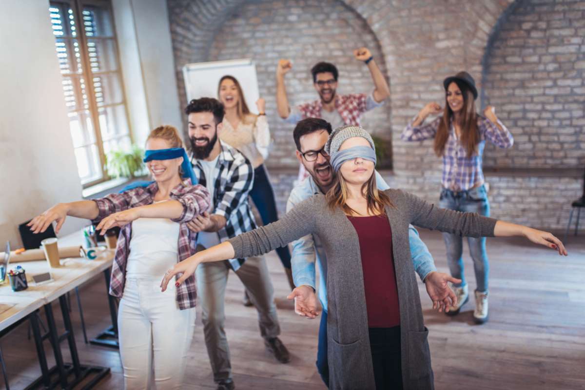 Group of people doing trust falls, can you trust AI-generated content concept